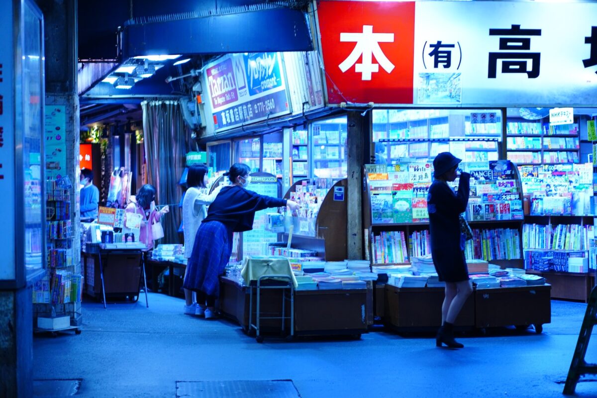 a person sitting at a desk in a store